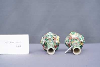 A pair of Chinese reticulated famille verte bottle vases, 19th C.
