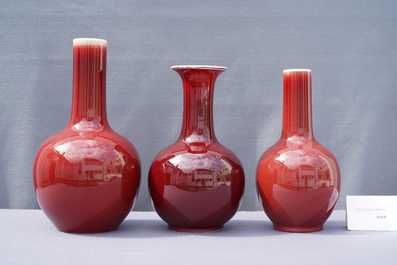 Three Chinese monochrome sang de boeuf-glazed bottle vases, 19/20th C.