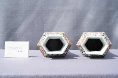 Two Chinese hexagonal Canton famille rose vases and covers, 19th C.