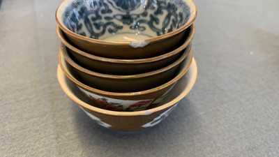 31 Chinese capucine brown-ground saucers and 22 cups, Kangxi/Qianlong