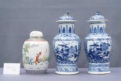 A pair of Chinese blue and white vases and a famille rose jar and cover, 19/20th C.