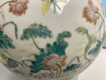 A Chinese famille rose bottle vase with mandarin ducks in a lotus pond, 19th C.