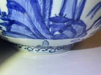 A large Chinese blue and white 'river landscape' bowl, Ming