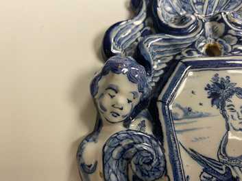 A pair of Dutch Delft blue and white appliques with royalist portraits of prince William IV and princess Anne, 18th C.