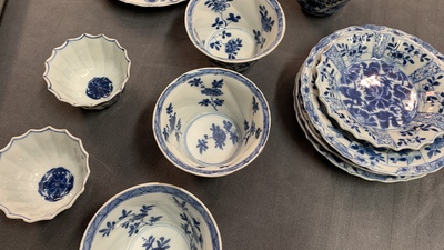 Six Chinese blue and white cups and saucers and eleven miniature vases, Kangxi