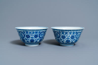 A pair of Chinese blue and white 'wan shou wu jiang' bowls, Qianlong mark and of the period