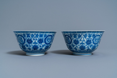 A pair of Chinese blue and white 'wan shou wu jiang' bowls, Qianlong mark and of the period