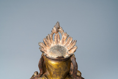 A Chinese gilt bronze figure of the seated Buddha, Ming