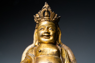 Een Chinese vergulde bronzen figuur van een zittende Boeddha, Ming