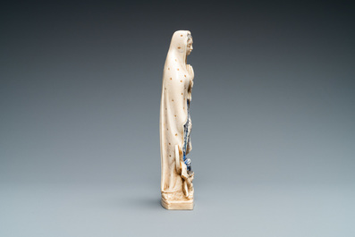 A polychromed and gilded ivory figure of a Madonna, 19th C.