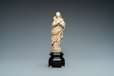 An ivory figure of a Madonna on wooden stand, Flanders or Germany, 17th C.