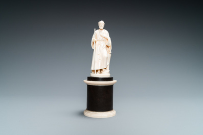 Une statue d'un Saint Ermite en ivoire sculpt&eacute; tenant un b&acirc;ton, socle en &eacute;b&egrave;ne et ivoire, Dieppe, 19&egrave;me