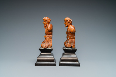 A pair of boxwood busts of a saint on an ebony veneer base, 17th C.