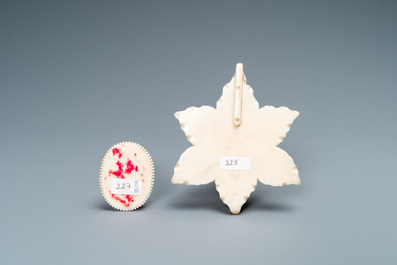 An ivory Christ medallion and a winged cherub's head on floral ground, probably France, late 18th C. and ca. 1900