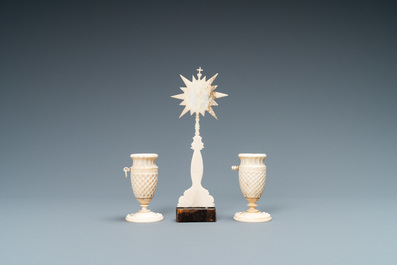A small ivory crucifix monstrance and a pair of small bone candlesticks, Dieppe, France, 19th C.