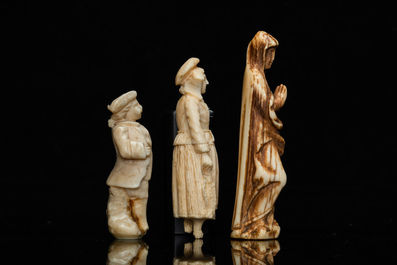Three ivory figures of a Madonna, a fish seller and a young lad, a.o. Dieppe, France, 18/19th C.