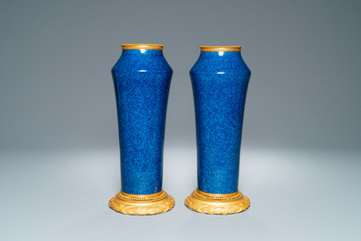 A pair of monochome powder blue S&egrave;vres vases with gilded bronze mounts, 19th C.