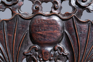 A Chinese bronze gong set in a carved wooden stand, 19th C.