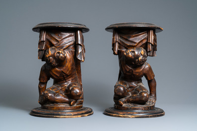 A pair of patinated coniferous wood candle supports in the shape of kneeling Moors, Venice, Italy, 17/18th C.