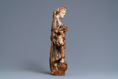 A polychromed wooden figure of a Madonna with child, 17/18th C.