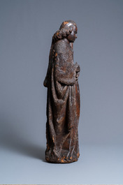 An oak figure of an angel holding the Instruments of the Passion, Brabant region, Southern Netherlands, early 15th C.