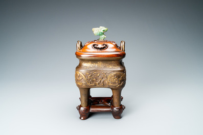 A Chinese partly gilded bronze censer with jade-topped wooden cover, Xuande mark, Kangxi