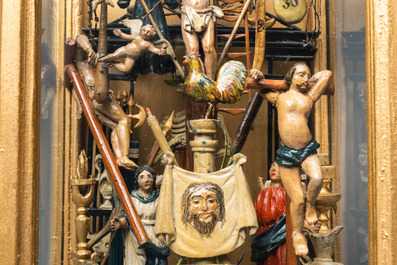 A polychromed wooden 'Golgotha' group with all the Instruments of the Passion in glass display, France or Italy, 18th C.