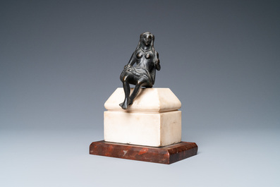 A black-patinated bronze figure of a young lady wearing a loincloth mounted on a marble base, Italy, 16th C.