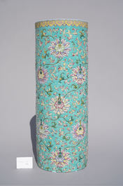 A large Chinese famille rose cylindrical vase with applied lotus scrolls, Jiaqing/Daoguang