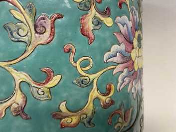 A large Chinese famille rose cylindrical vase with applied lotus scrolls, Jiaqing/Daoguang