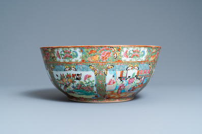 A large Chinese Canton famille rose bowl on wooden stand, 19th C.