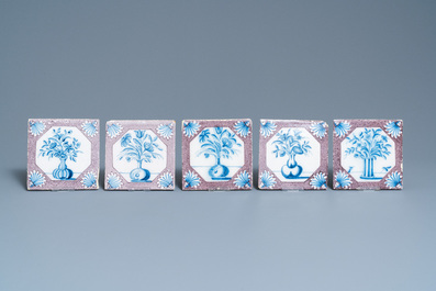 Twenty-five Dutch Delft blue, white and manganese flower vase tiles, 18th C.