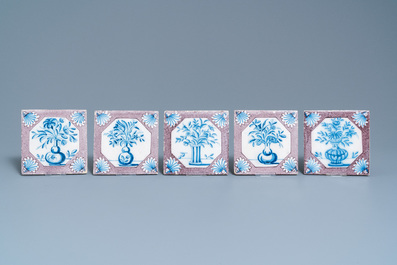 Twenty-five Dutch Delft blue, white and manganese flower vase tiles, 18th C.