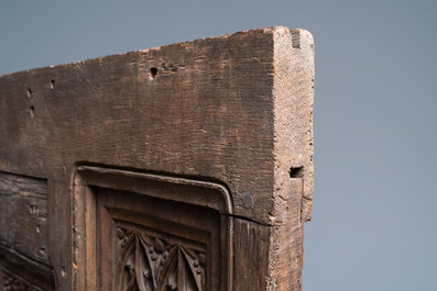 A carved oak front panel of a coffer with tracery panels, 15th C.