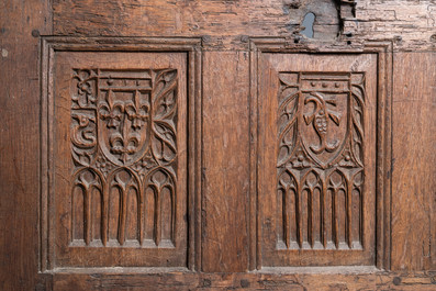 A carved oak front panel of a coffer with the arms of France and the Dauphin, France, 2nd half 15th C.