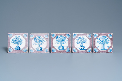 Twenty-five Dutch Delft blue, white and manganese flower vase tiles, 18th C.