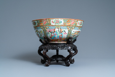 A large Chinese Canton famille rose bowl on wooden stand, 19th C.