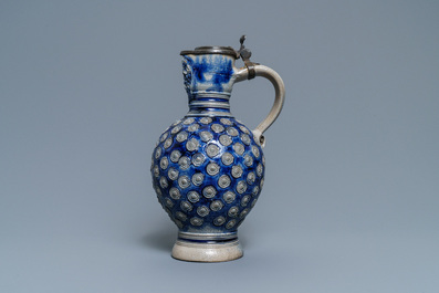 A German pewter-mounted stoneware 'enghals' jug with applied floral medallions and a mascaron, Westerwald, mid 17th C.