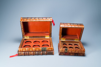 Four trompe-l'oeil storage boxes made from old book covers, France, 20th C.