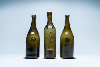 Three green glass wine bottles with crowned seals, 18/19th C.