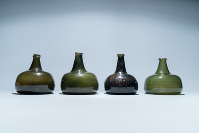 Four green glass wine bottles, 17/18th C.