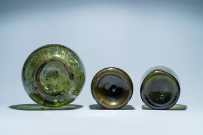 Three large green glass bottles, 18th C.