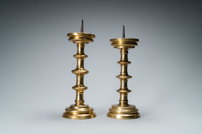 A composite pair of brass alloy candlesticks, Germany, 16th C.