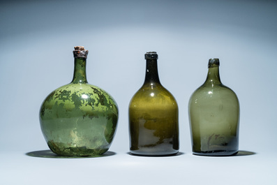 Three large green glass bottles, 18th C.