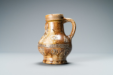 A German stoneware bellarmine jug with a text band and portrait medallions, Frechen, 16th C.