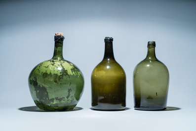 Three large green glass bottles, 18th C.