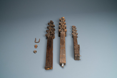 A carved oak shelf with pinnacles and stylised flowers and carved panels, 15th C. and later