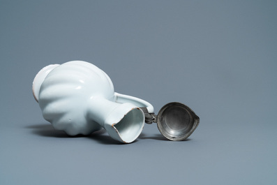 A large gadrooned white Dutch Delftware jug with pewter cover, 17th C.