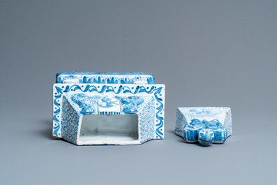 A Dutch Delft blue and white fireplace-shaped box and cover, ca. 1800