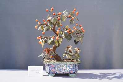 A pair of large Chinese Canton enamel jardini&egrave;res with jade and hardstone trees, 19th C.